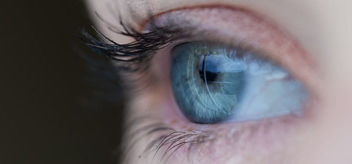 a zoomed in image of someone's blue eye