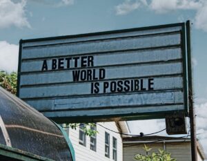 Billboard reading, "A Better World Is Possible"