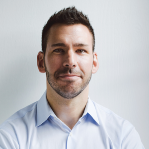 Headshot of Elliot Felix, CEO of brightspot. He is a White man wearing a light blue collared shirt against a white background.