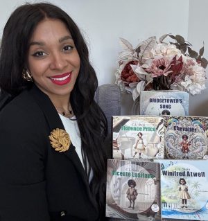 Crystal Stein, a Black woman with long brown hair, red lipstick, and a black blazer, poses with her "Echoes of Excellence" collection: multi-sensory board books about Black composers.