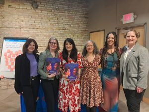 AmazeWorks staff, Lerner Publishing Group, Sun Yung Shin, Mélina Mangal, and Leslie Barlow smiling at the Revolutions Are Made of Love book launch