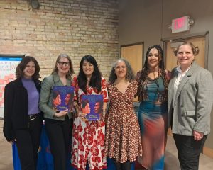AmazeWorks staff, Lerner Publishing Group, Sun Yung Shin, Mélina Mangal, and Leslie Barlow smiling at the Revolutions Are Made of Love book launch