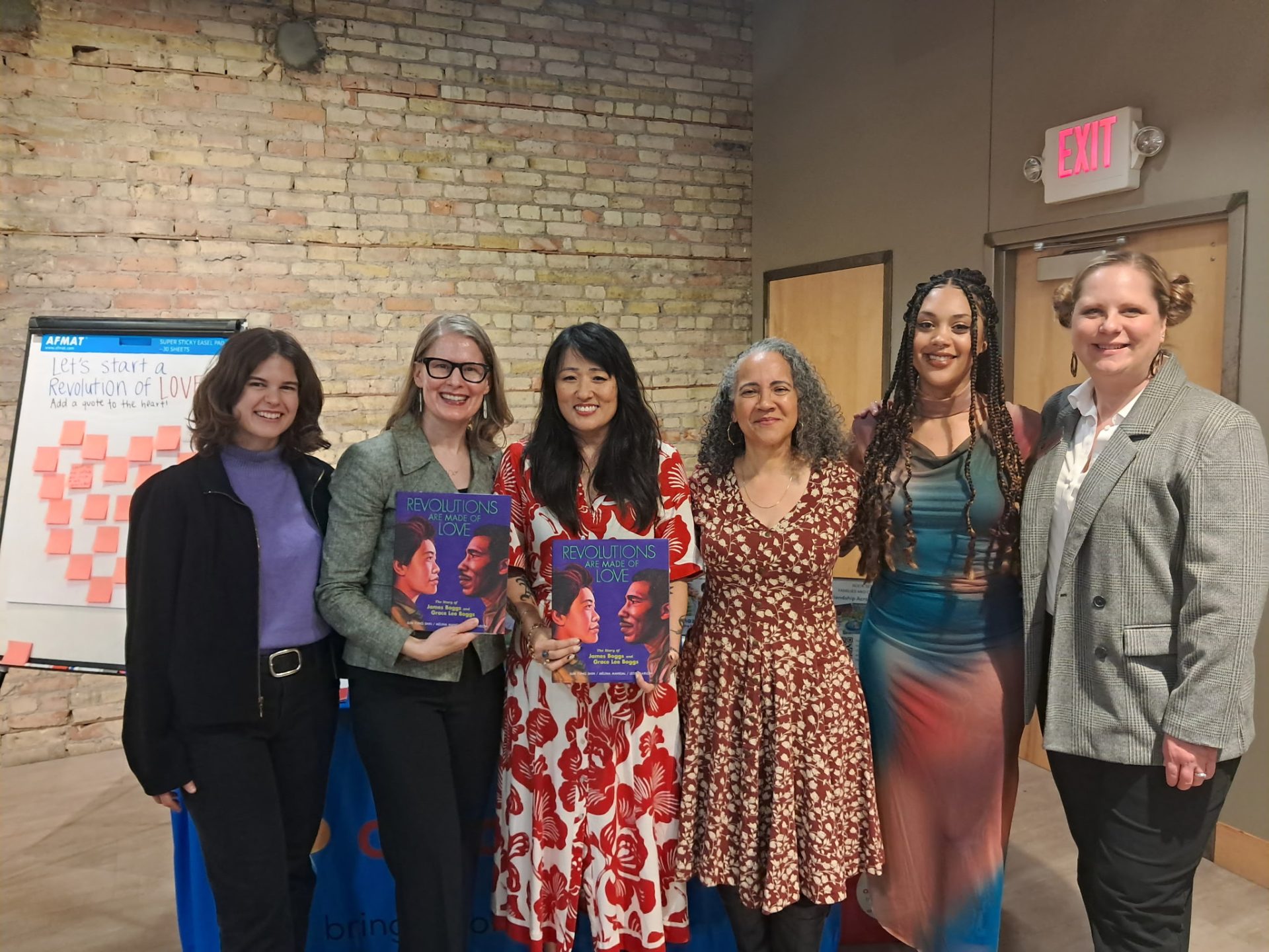 AmazeWorks staff, Lerner Publishing Group, Sun Yung Shin, Mélina Mangal, and Leslie Barlow smiling at the Revolutions Are Made of Love book launch