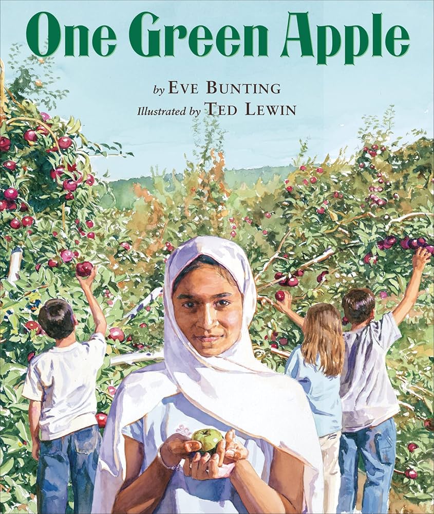 One Green Apple book cover, picturing a girl holding an apple in her hand