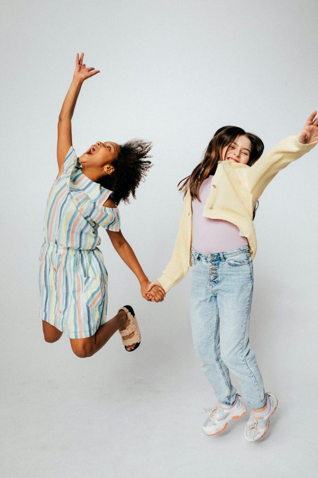 two children jumping in the air