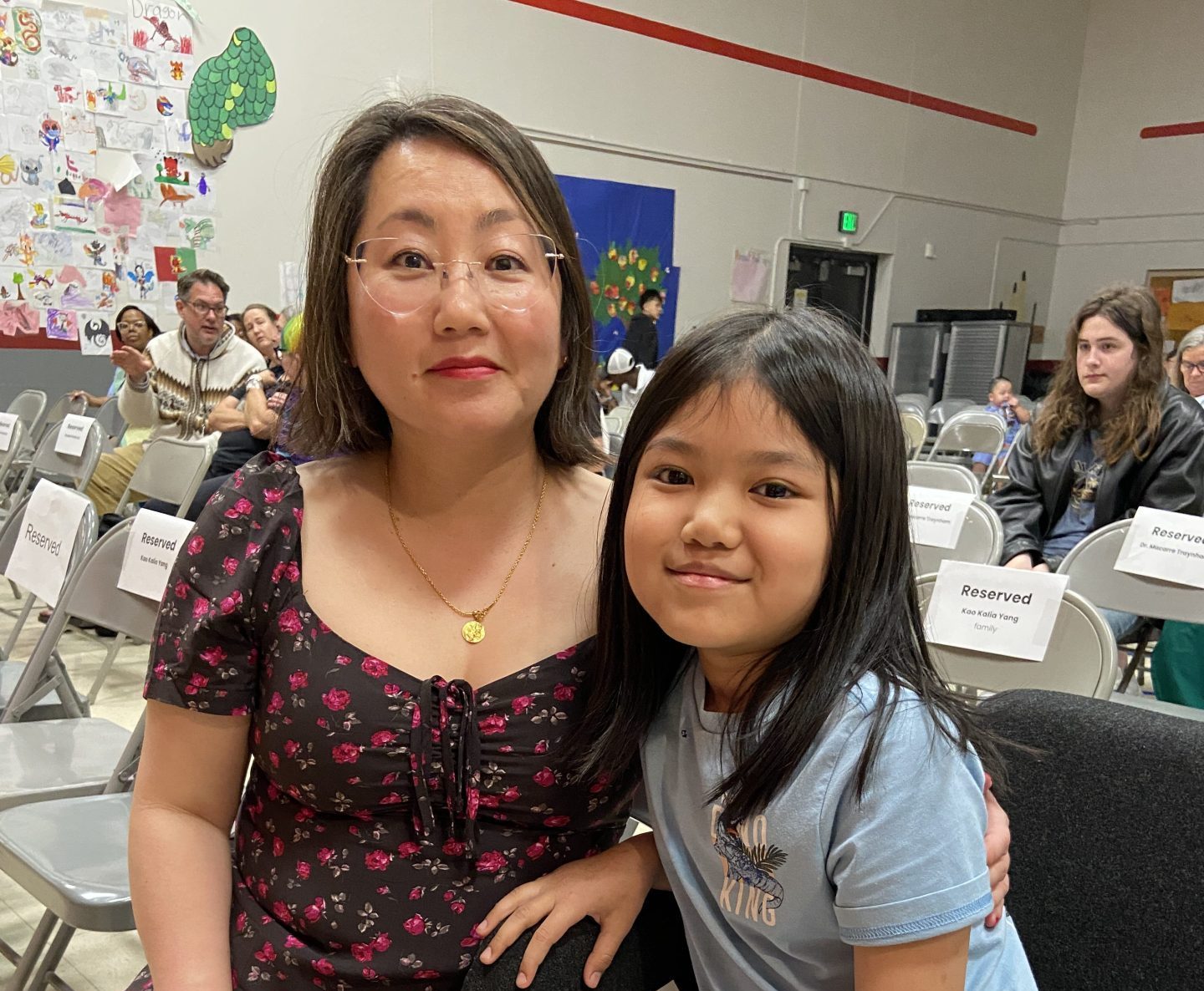 Kao Kalia Yang poses with a Mississippi Creative Arts School student